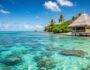 Tropical beach hut with turquoise water.